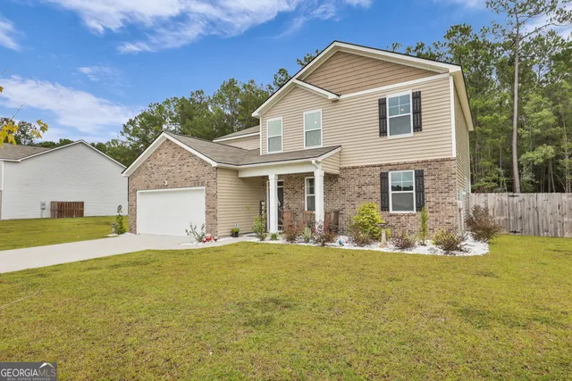 a front view of a house with a yard