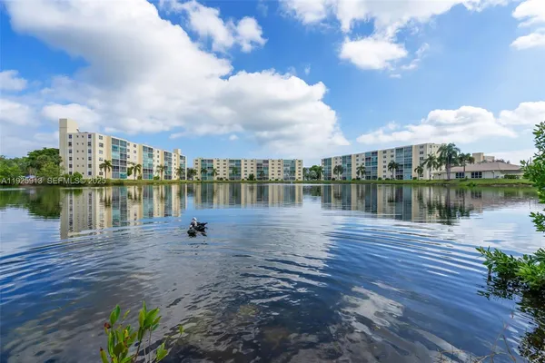 a lake view with a large trees
