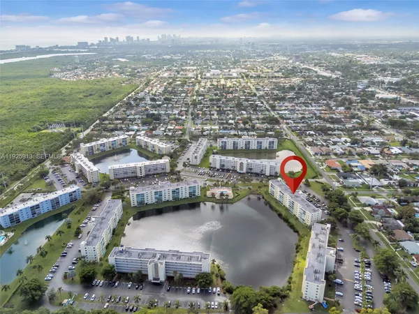 an aerial view of a house with a yard
