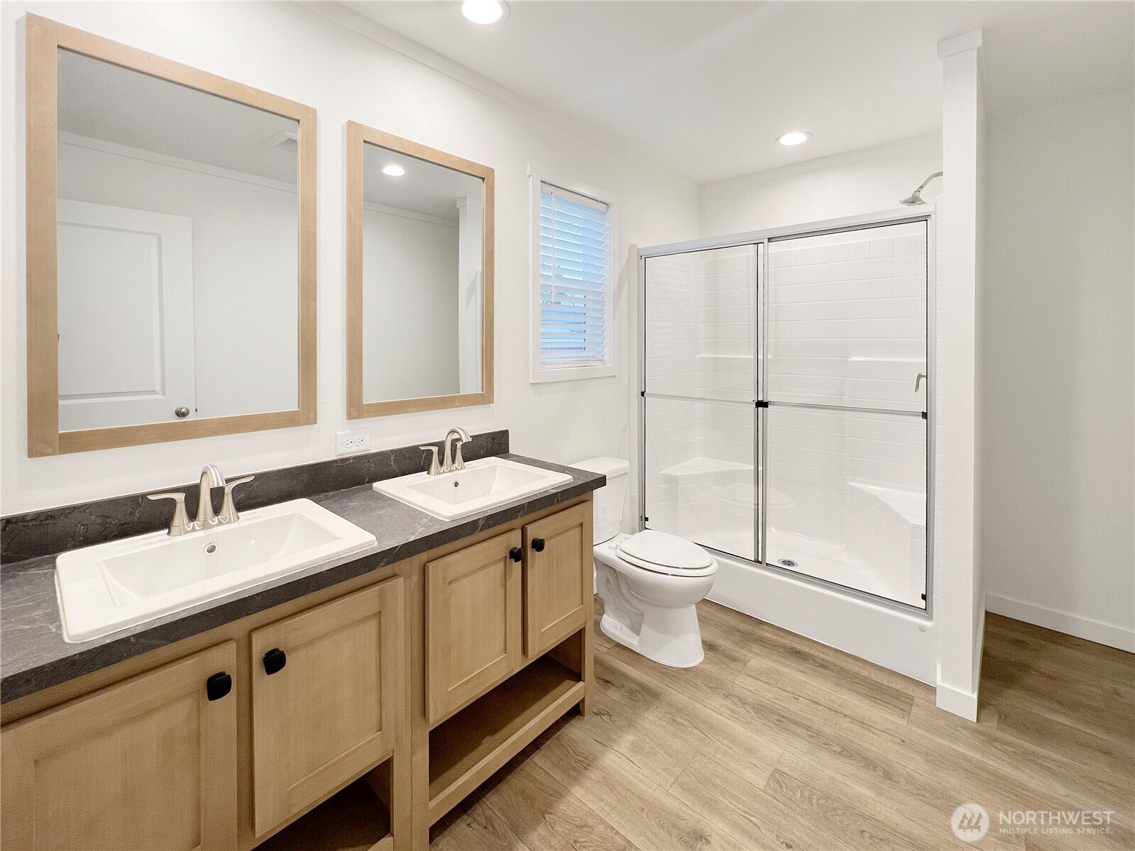 10900 Kuhlman Road Southeast, Unit 84 Olympia, WA 98513 - Photo 15 of 20 a bathroom with a double vanity sink and mirror