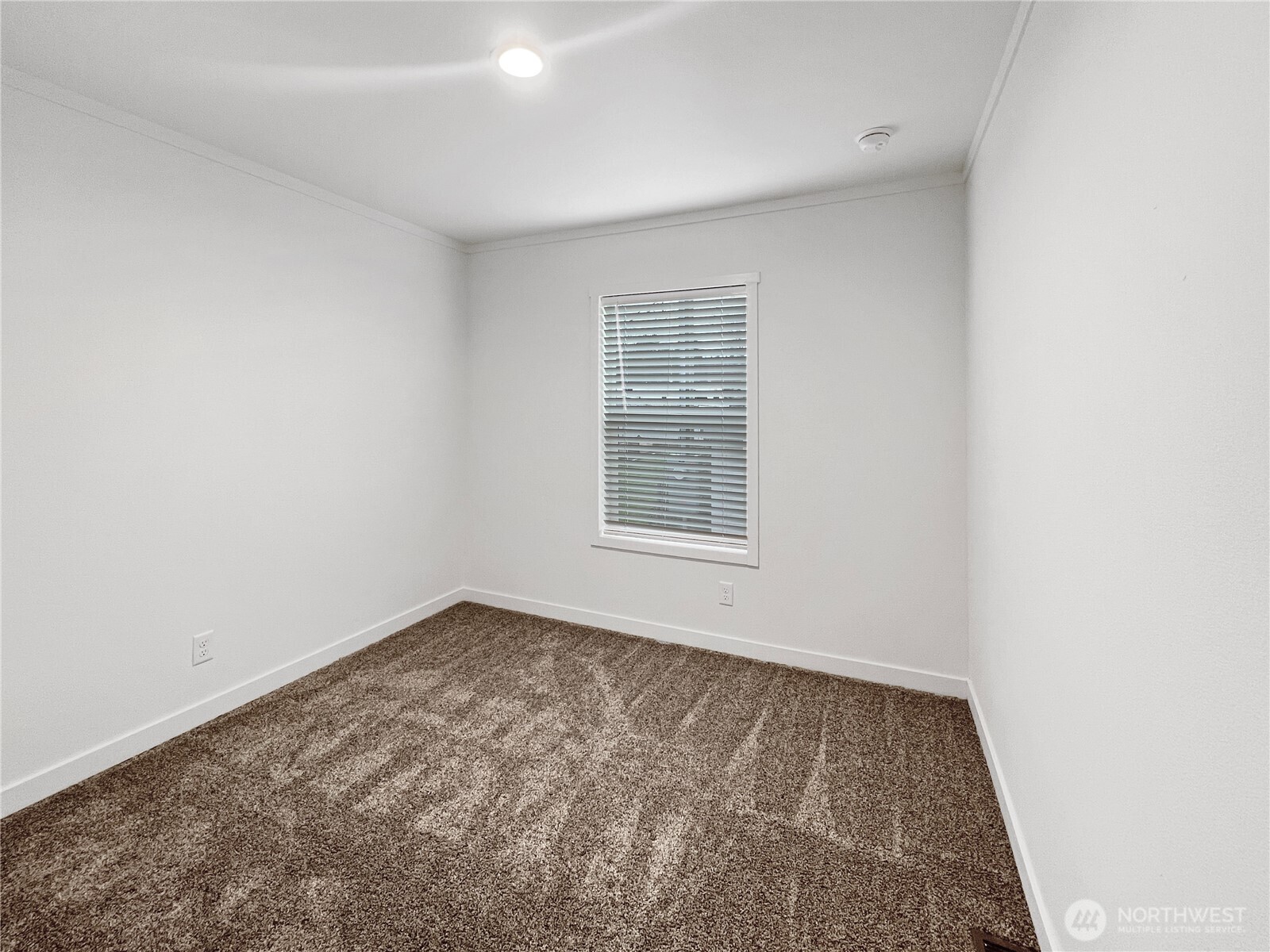10900 Kuhlman Road Southeast, Unit 84 Olympia, WA 98513 - Photo 16 of 20 an empty room with a window