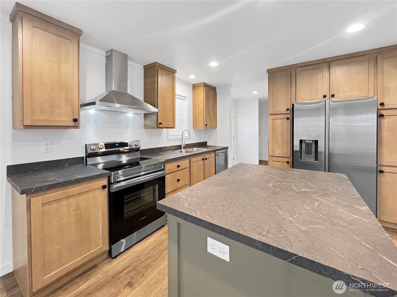 10900 Kuhlman Road Southeast, Unit 84 Olympia, WA 98513 - Photo 7 of 20 a kitchen with stainless steel appliances granite countertop a stove a refrigerator and a sink