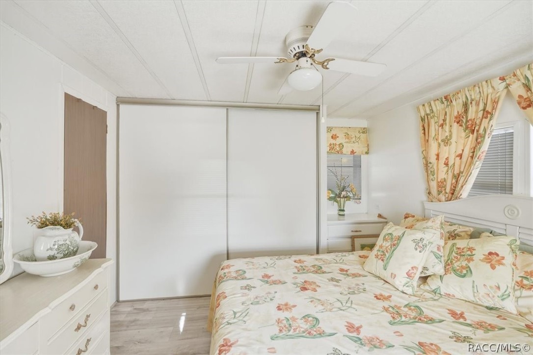 928 South Shad Terrace Inverness, FL 34450 - Photo 23 of 48 a bedroom with a bed and a dresser