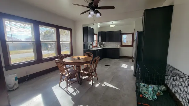 a view of a dining room with furniture window and outside view