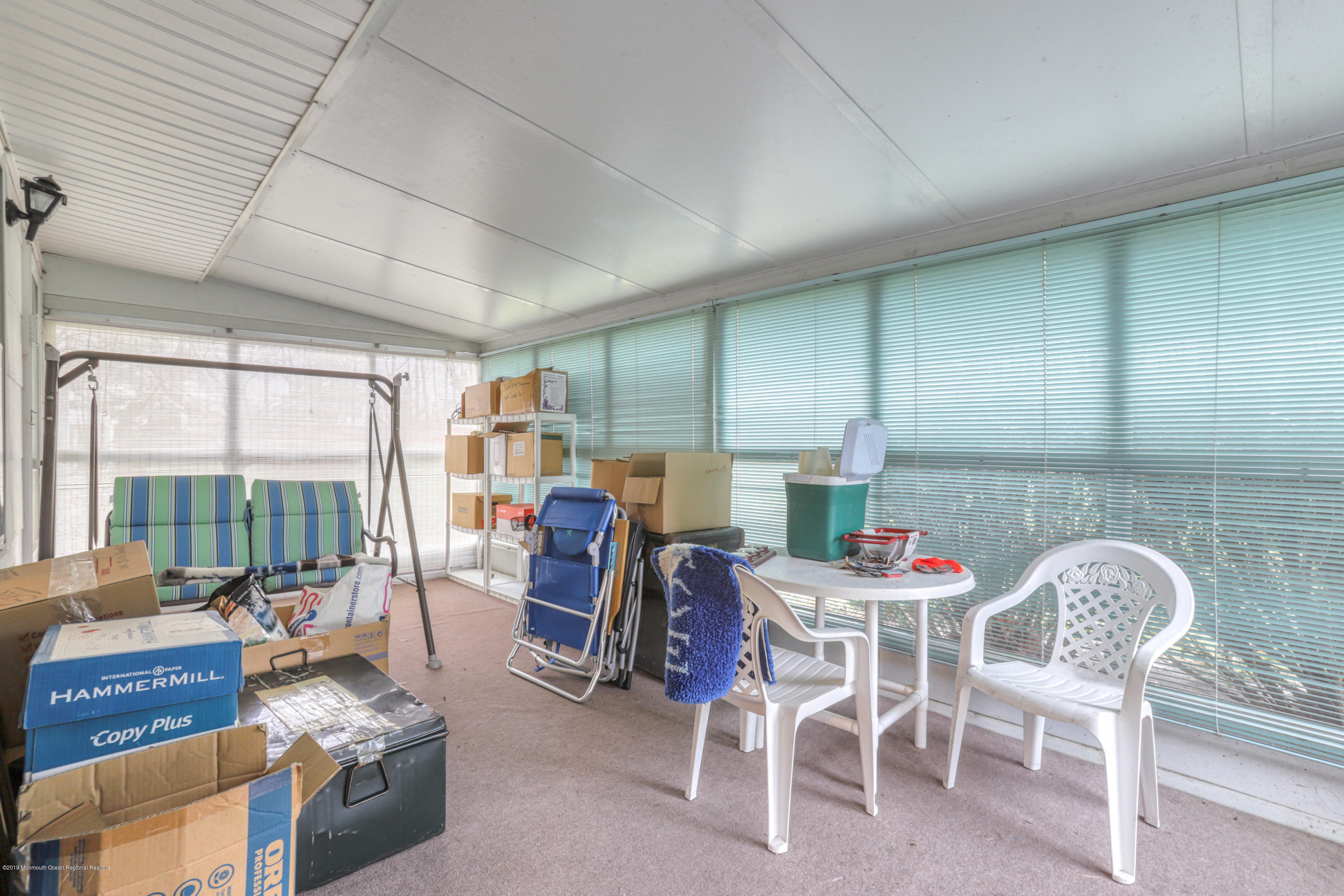 57 Whitman Street Brick, NJ 08724 - Photo 12 of 18 a view of a dining room with furniture a kitchen and chandelier