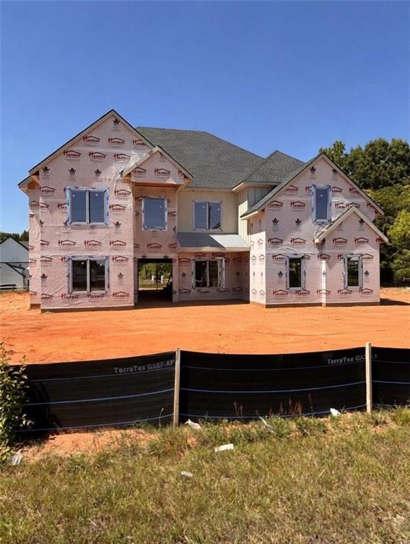 3285 Hall Road Dacula, GA 30019 - Photo 1 of 20 a front view of a house with large windows