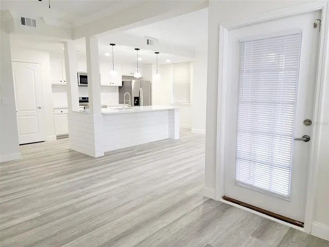 a view of kitchen with wooden floor