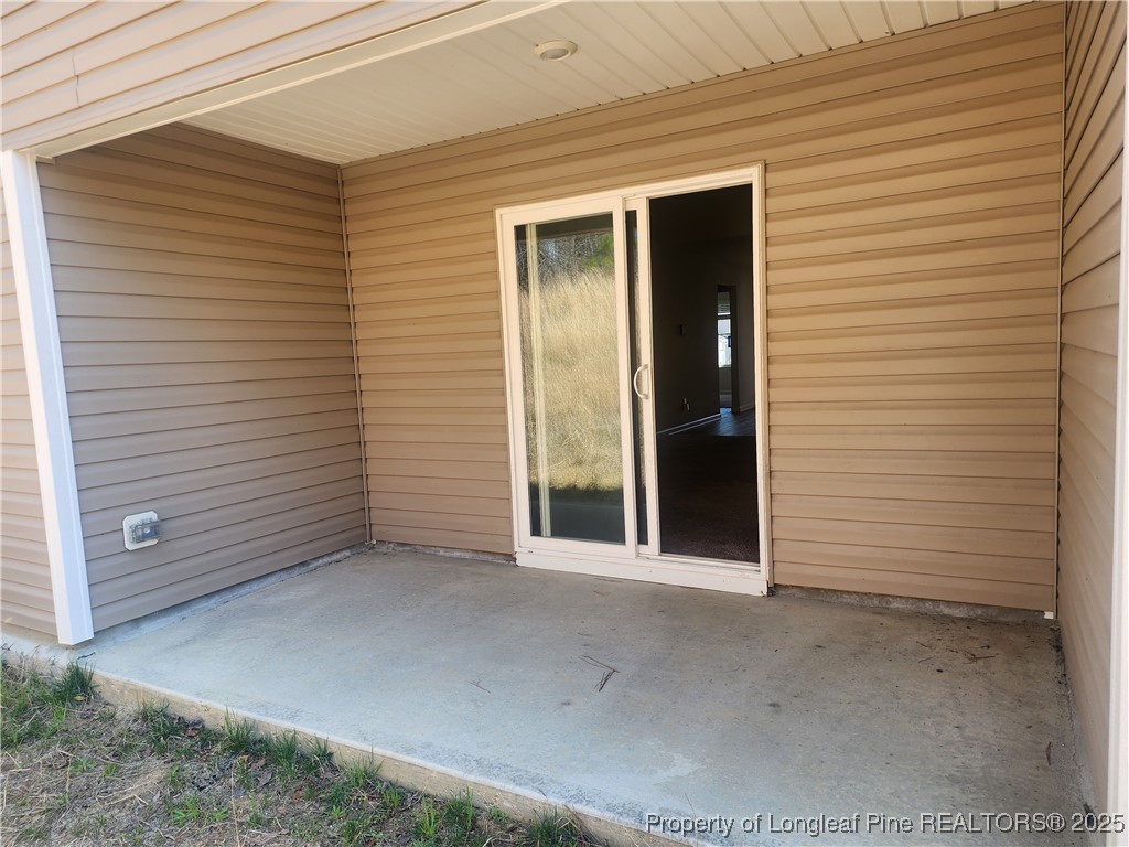 207 Barnsley Road Angier, NC 27501 - Photo 15 of 16 a view of a wooden door of the house