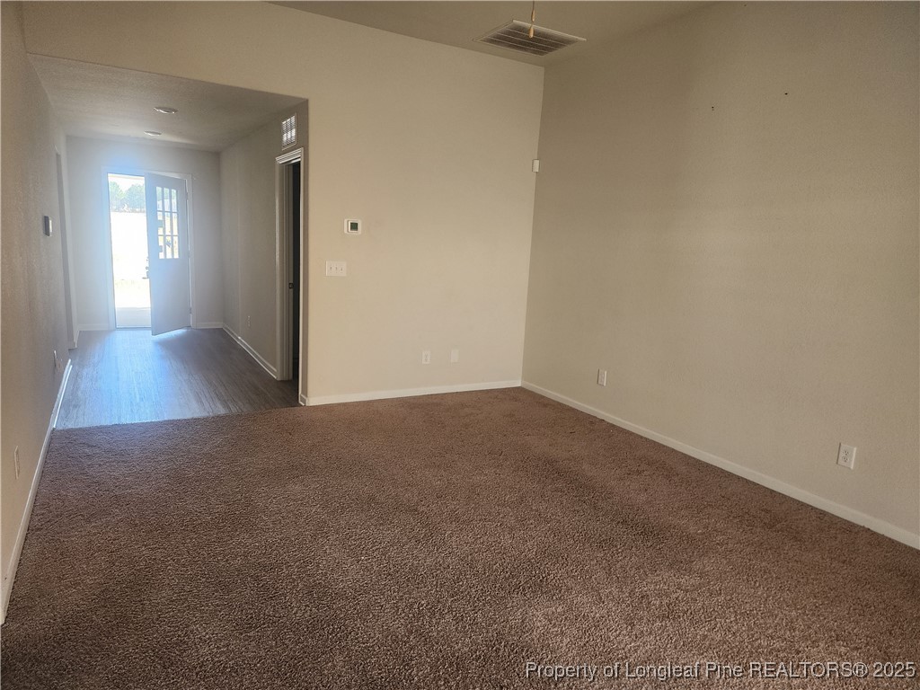 207 Barnsley Road Angier, NC 27501 - Photo 3 of 16 a view of empty room with wooden floor