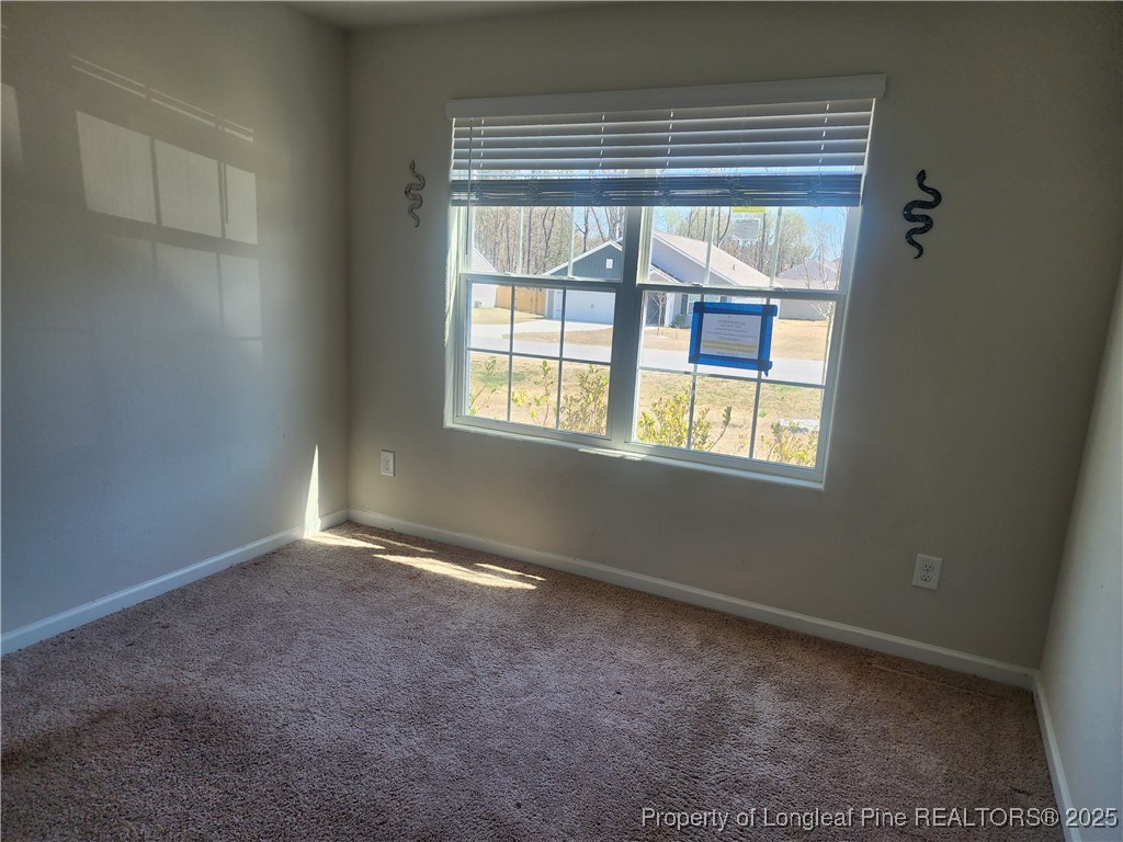 207 Barnsley Road Angier, NC 27501 - Photo 4 of 16 a view of an empty room with a window