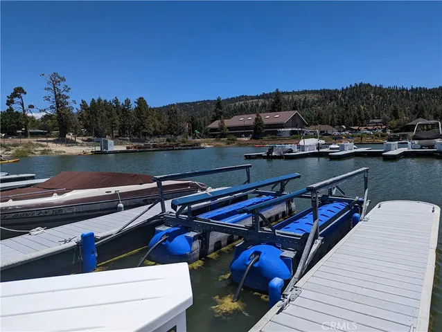 a view of a balcony with chairs and wooden floor