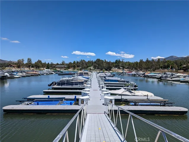 a view of a swimming pool with a table and chairs