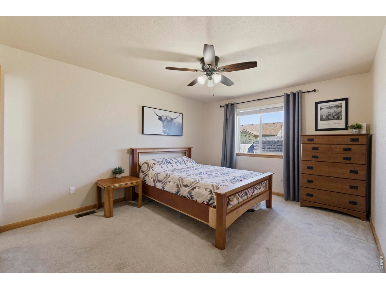 331 South Maple Avenue Eaton, CO 80615 - Photo 17 of 40 a bedroom with a bed dresser and a window