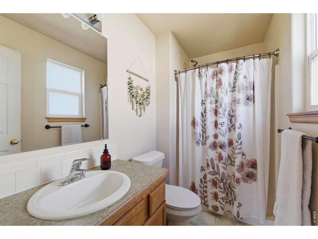 331 South Maple Avenue Eaton, CO 80615 - Photo 19 of 40 a bathroom with a sink toilet and shower