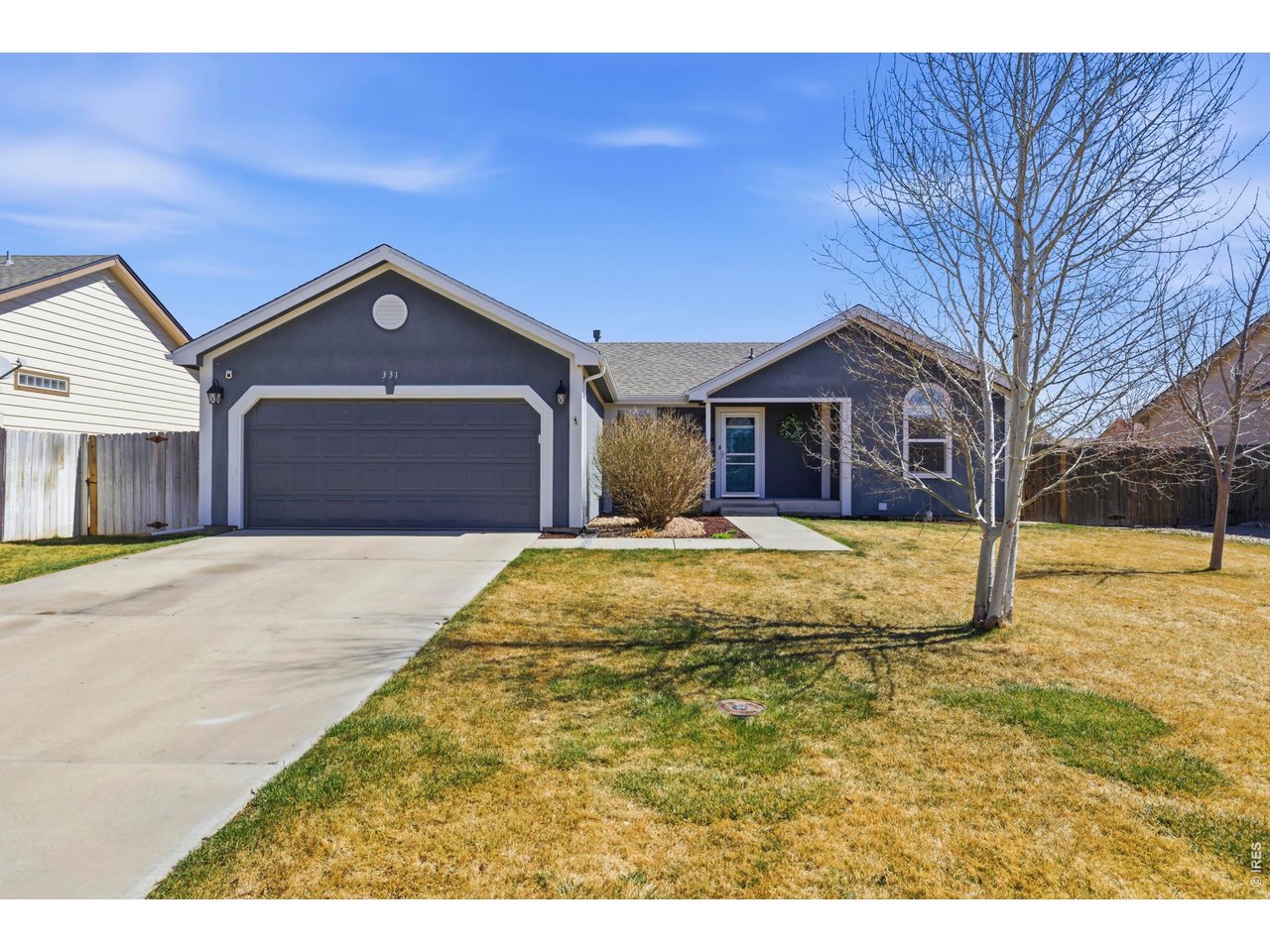 331 South Maple Avenue Eaton, CO 80615 - Photo 2 of 40 a front view of a house with a yard