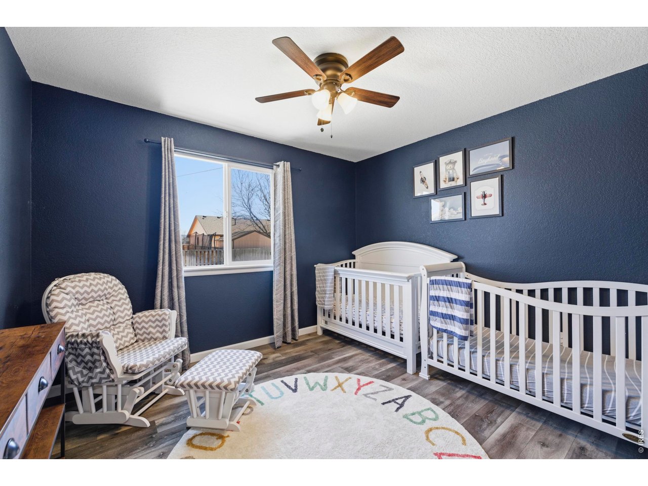 331 South Maple Avenue Eaton, CO 80615 - Photo 21 of 40 a bedroom with a bed and a window