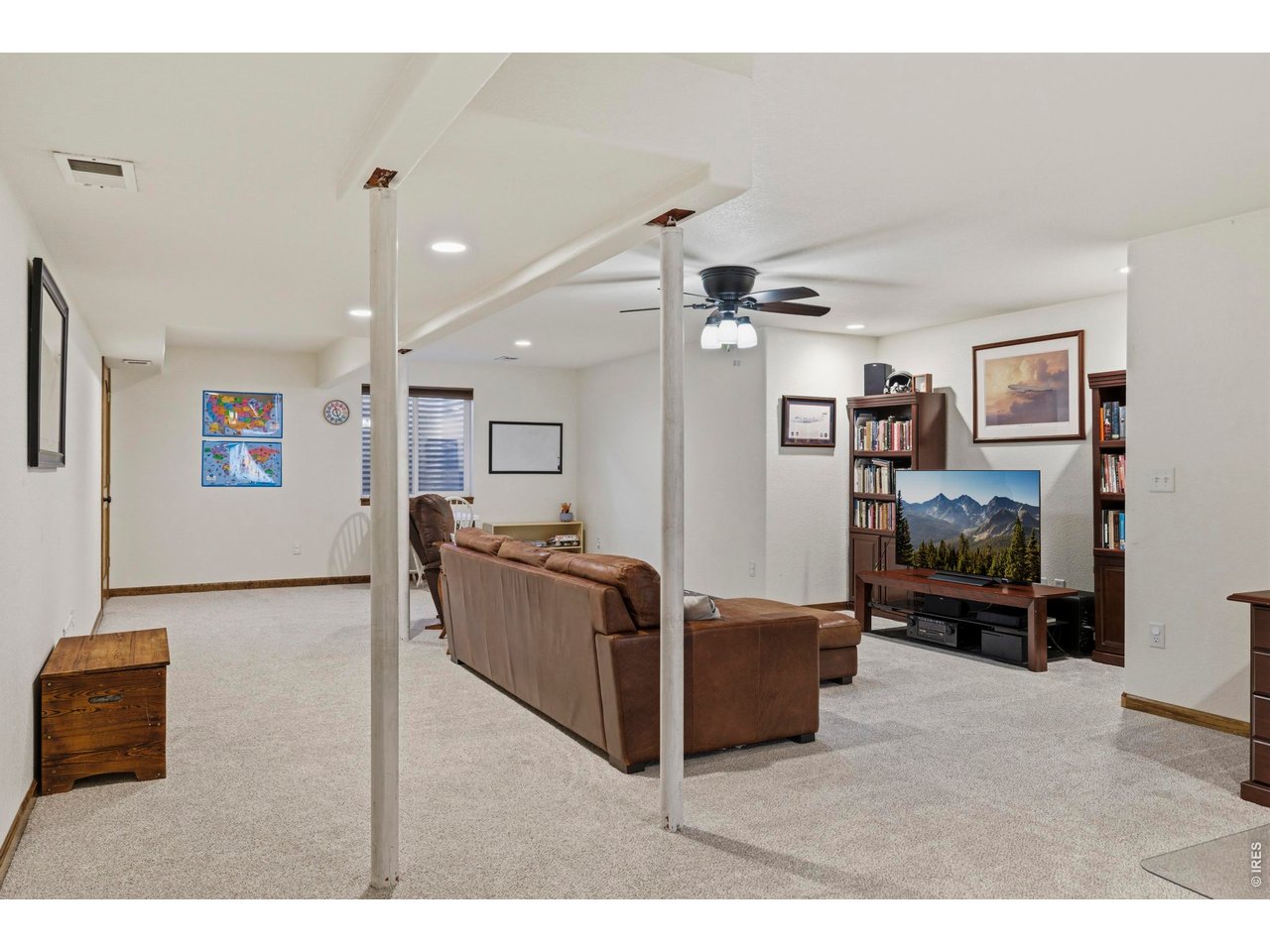 331 South Maple Avenue Eaton, CO 80615 - Photo 24 of 40 a living room with furniture and a flat screen tv