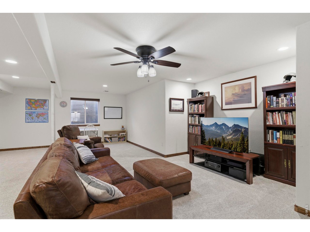 331 South Maple Avenue Eaton, CO 80615 - Photo 27 of 40 a living room with furniture and a flat screen tv