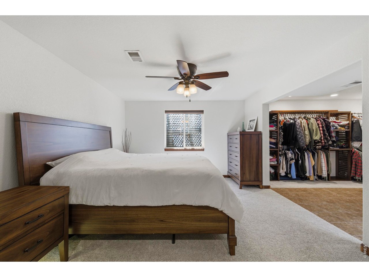 331 South Maple Avenue Eaton, CO 80615 - Photo 29 of 40 a bedroom with a bed and a ceiling fan