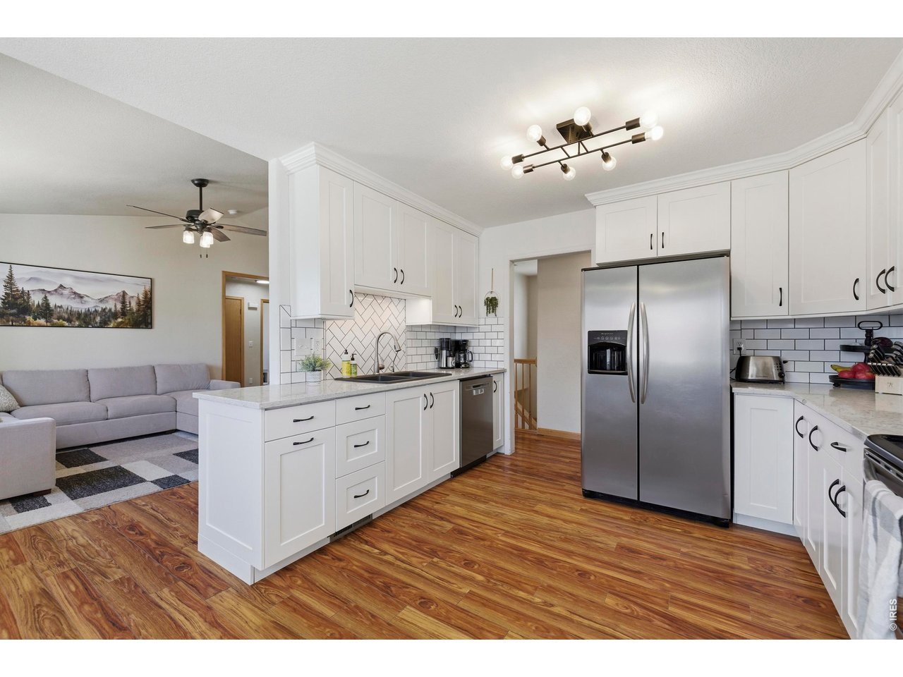 331 South Maple Avenue Eaton, CO 80615 - Photo 5 of 40 a kitchen with a refrigerator sink and cabinets