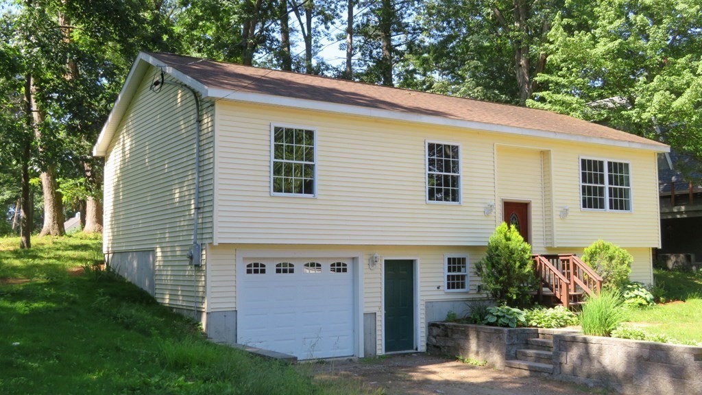 4 Sandy Beach Road Westford, MA 01886 - Photo 1 of 15 a view of a house with a yard and potted plants