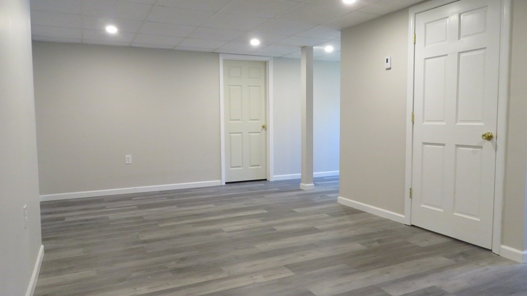 4 Sandy Beach Road Westford, MA 01886 - Photo 3 of 15 a view of an empty room with wooden floor