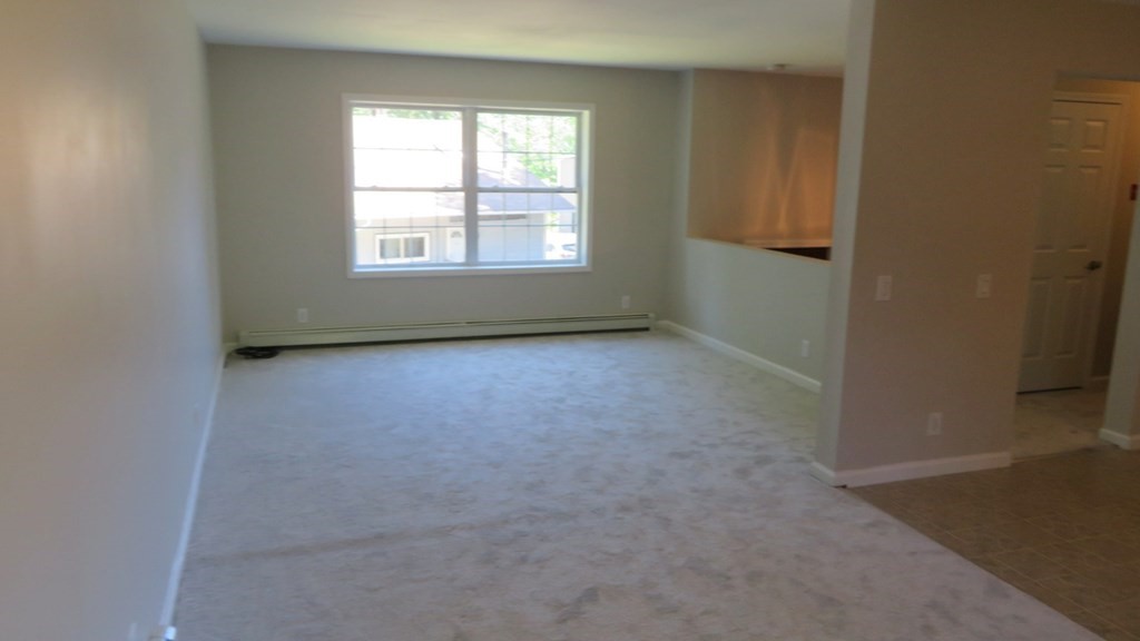 4 Sandy Beach Road Westford, MA 01886 - Photo 5 of 15 an empty room with windows