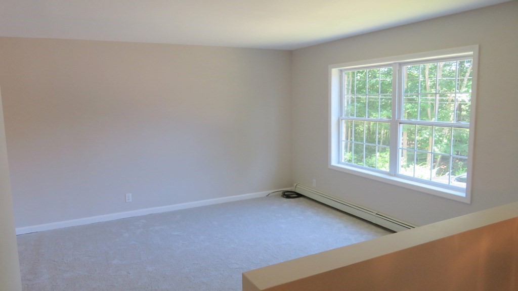 4 Sandy Beach Road Westford, MA 01886 - Photo 8 of 15 an empty room with a window