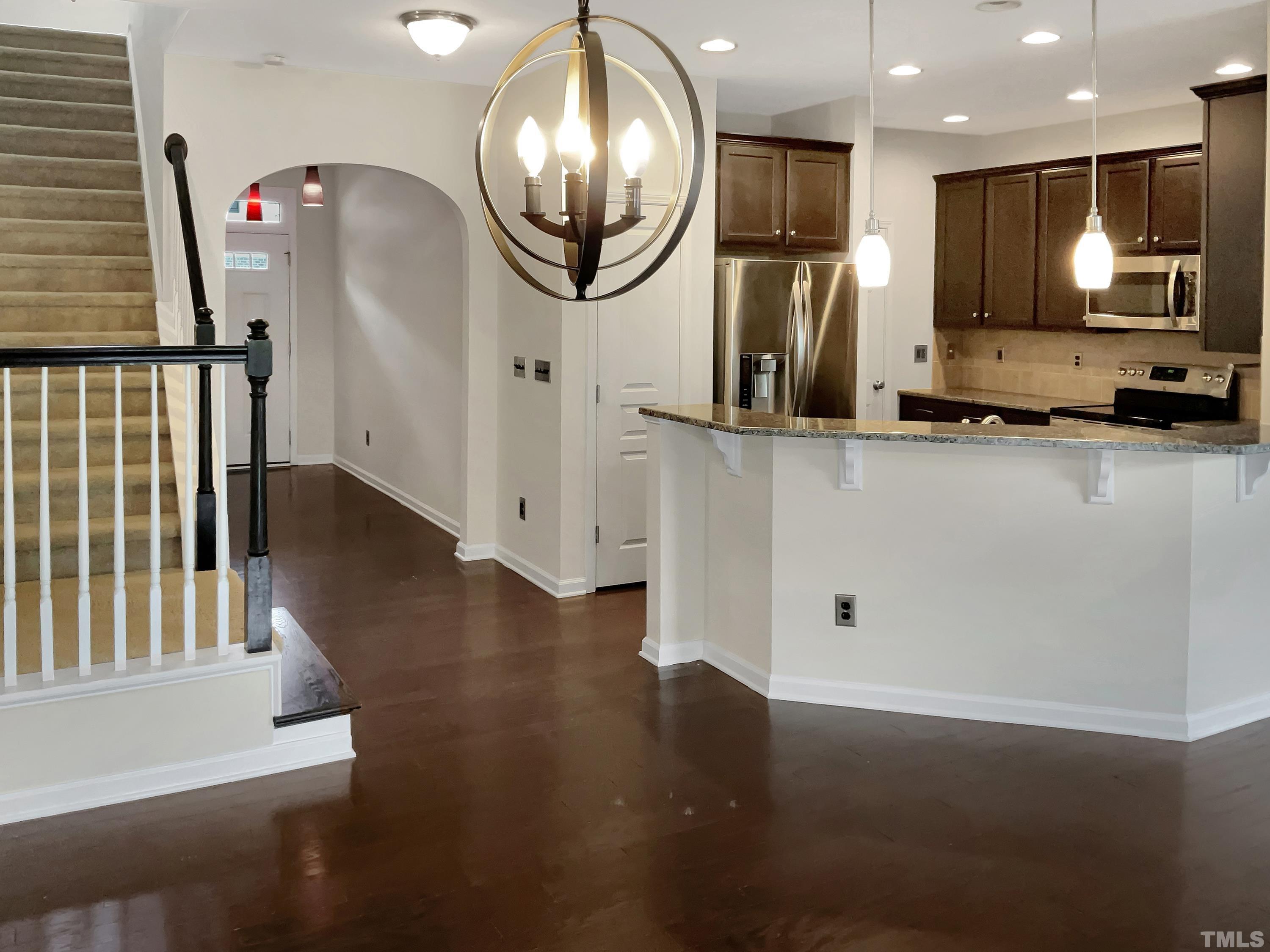 7249 Terregles Drive Raleigh, NC 27617 - Photo 13 of 36 an empty room with wooden floor and windows