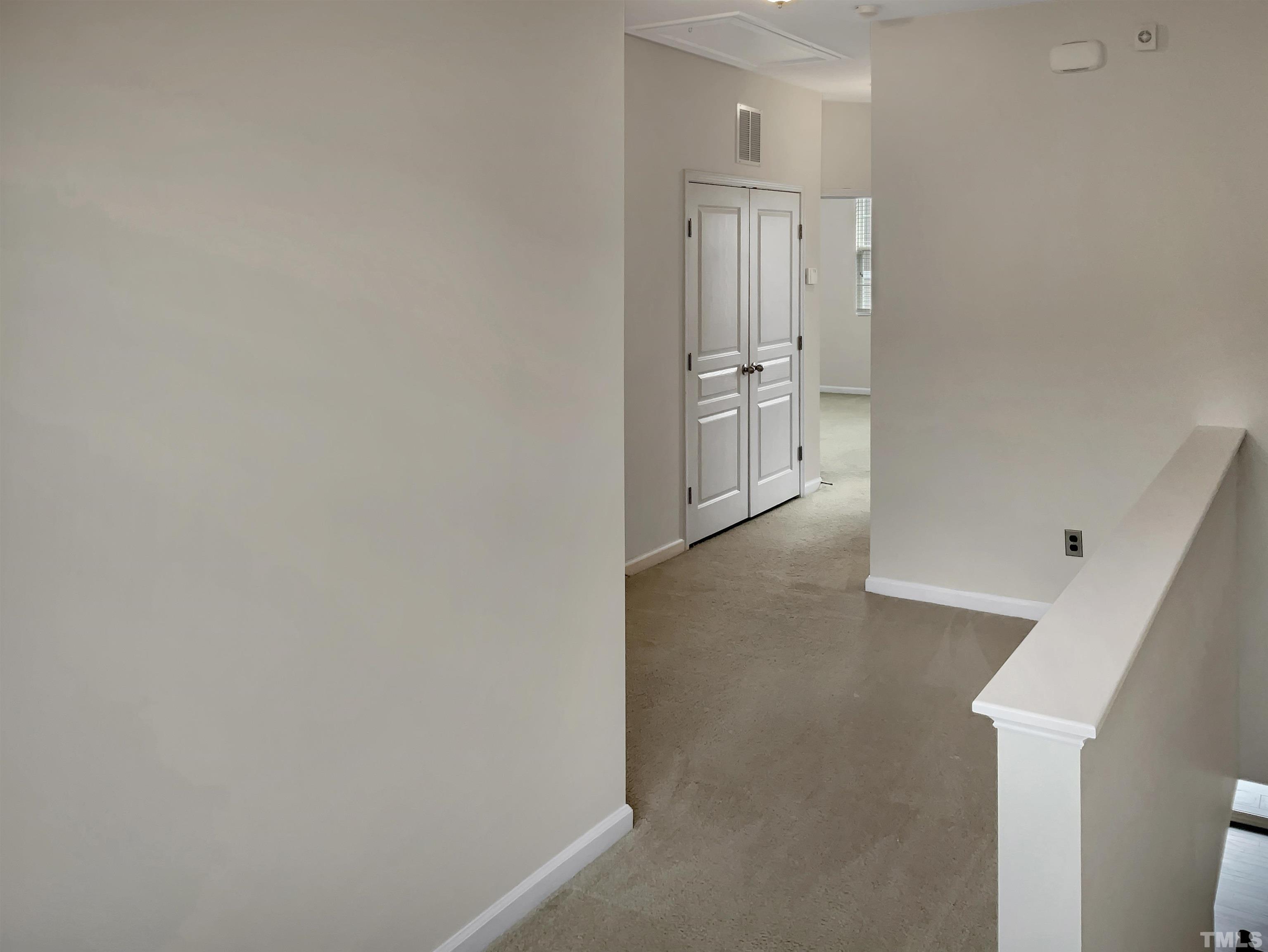 7249 Terregles Drive Raleigh, NC 27617 - Photo 15 of 36 a view of a hallway with two rooms