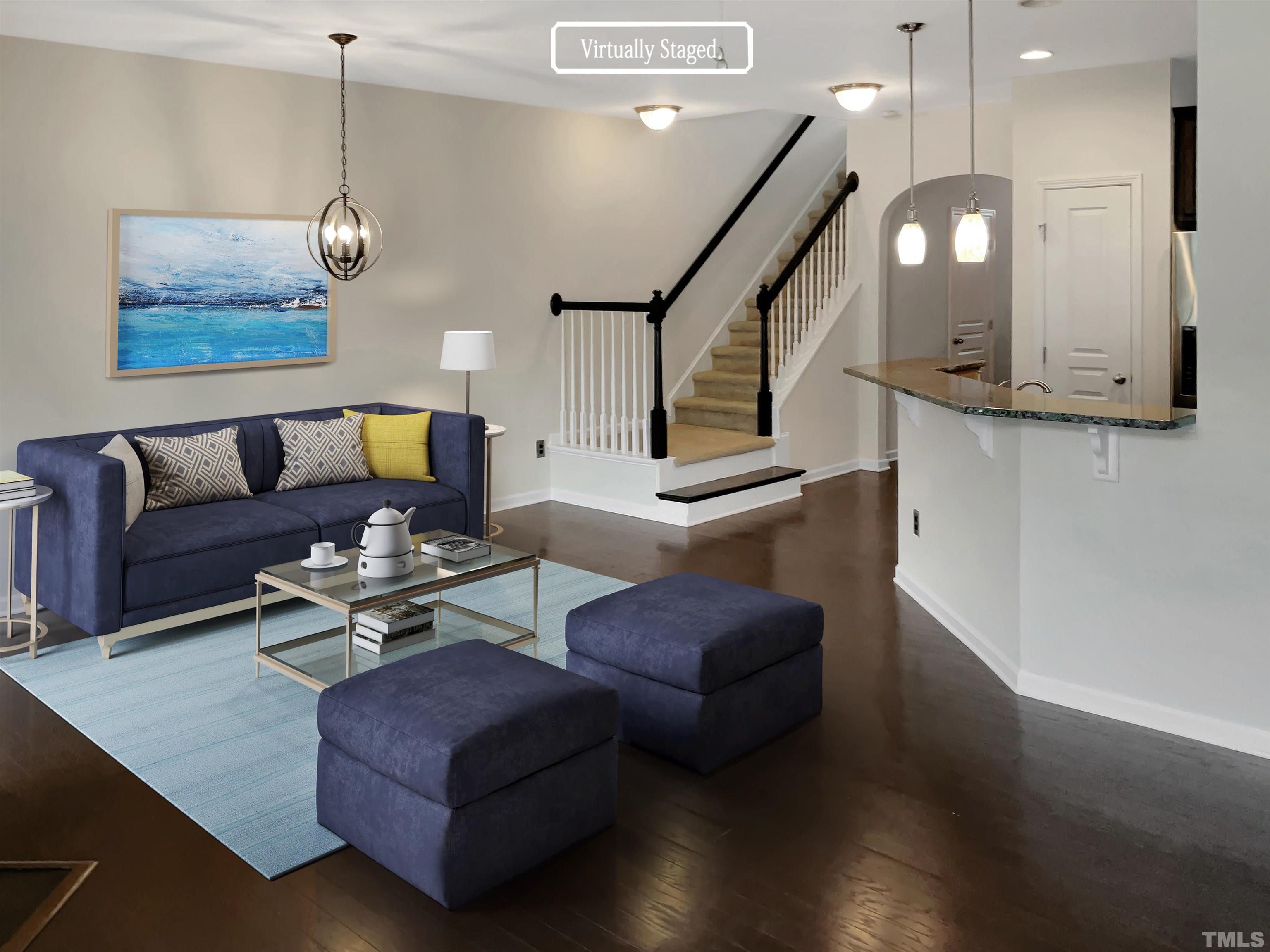 7249 Terregles Drive Raleigh, NC 27617 - Photo 2 of 36 a living room with furniture and a wooden floor