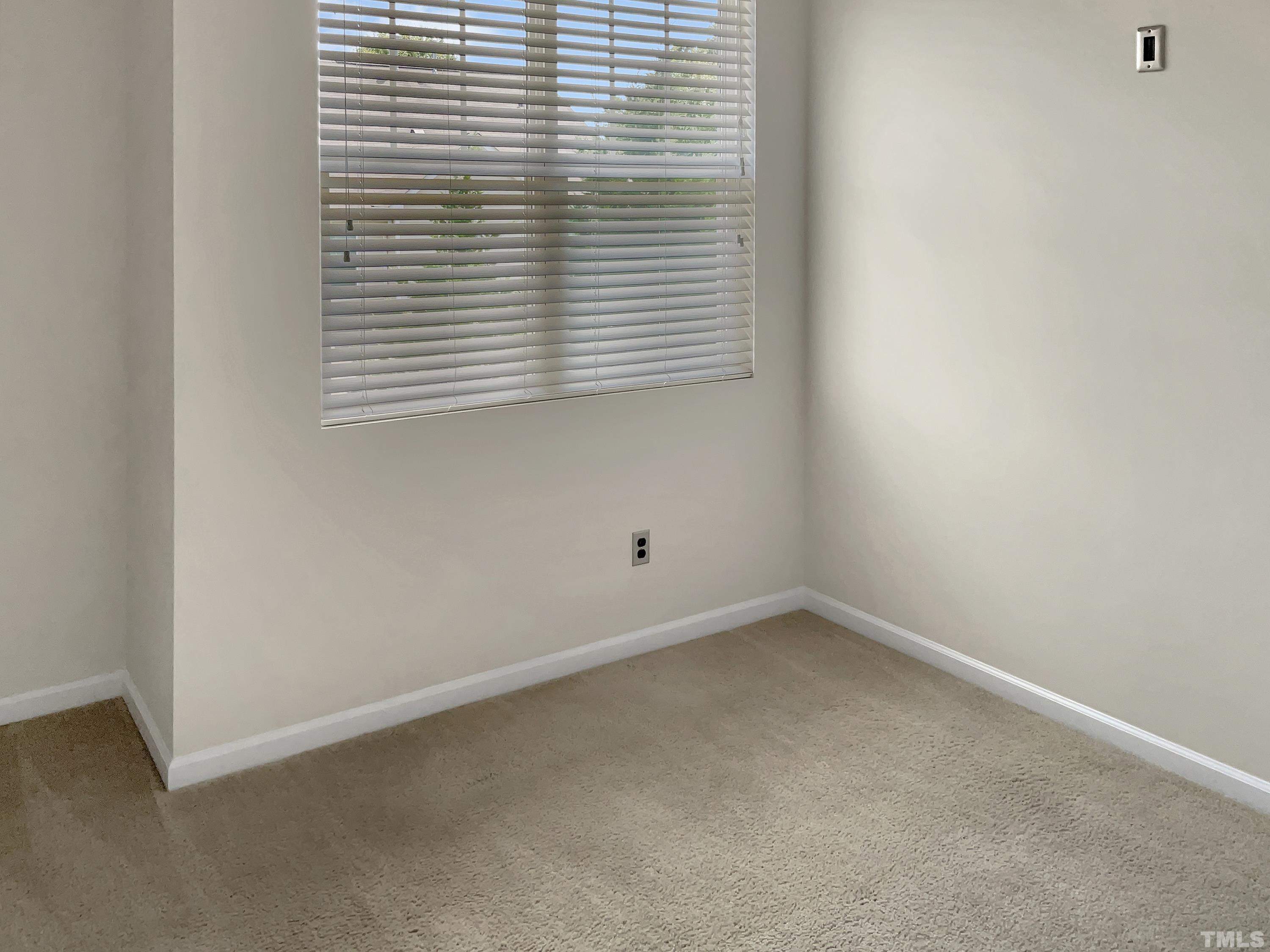 7249 Terregles Drive Raleigh, NC 27617 - Photo 25 of 36 an empty room with a window