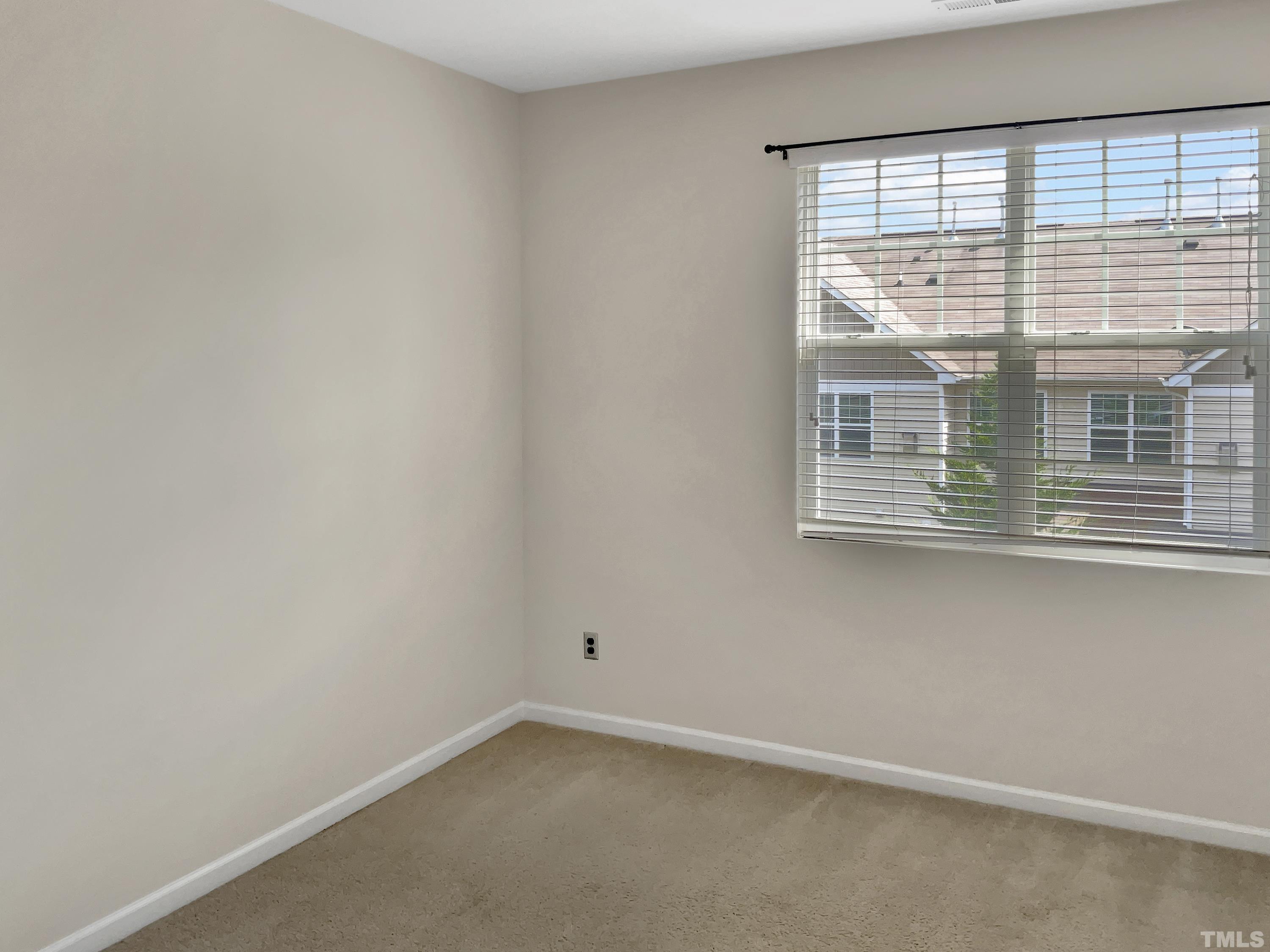 7249 Terregles Drive Raleigh, NC 27617 - Photo 29 of 36 an empty room with a window