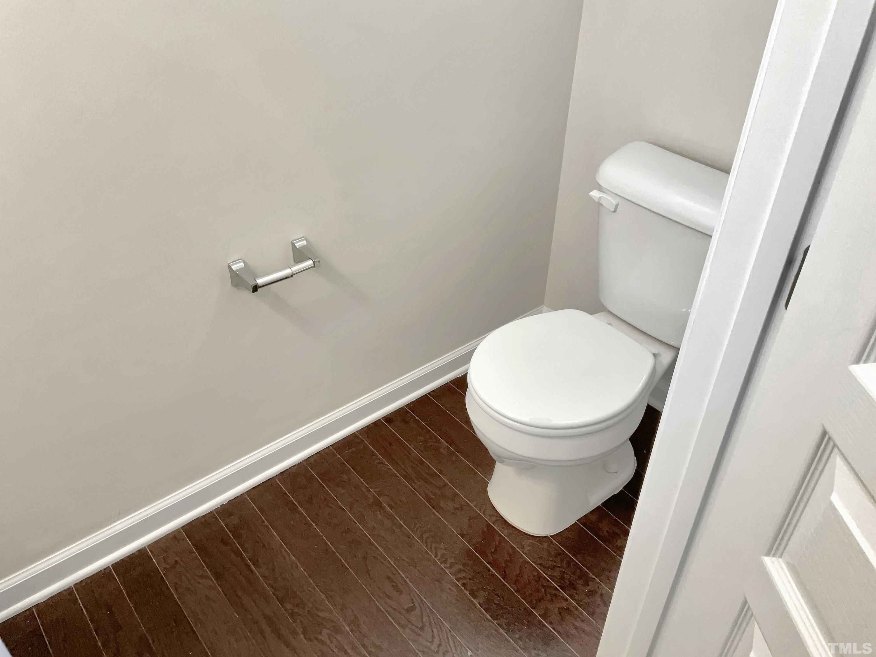 7249 Terregles Drive Raleigh, NC 27617 - Photo 8 of 36 a bathroom with a toilet and a sink