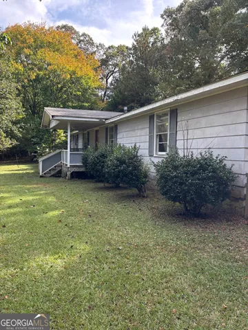 a view of a house with a garden