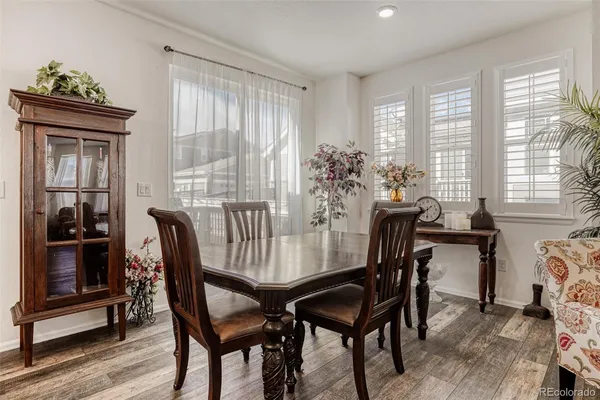 a view of a dining room with furniture and window