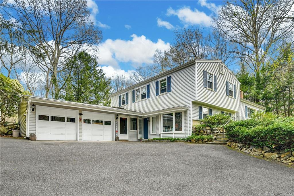 379 Cascade Road Stamford, CT 06903 - Photo 1 of 1 a front view of a house with a garden