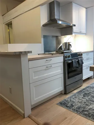 a kitchen with a stove and a sink