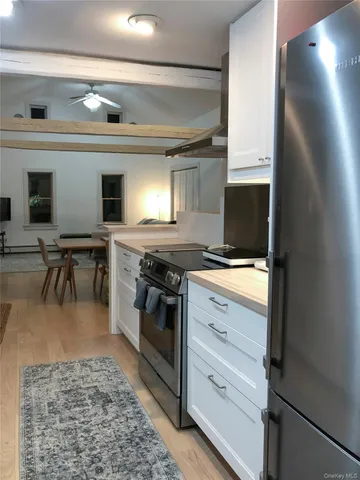 a kitchen with a stove and a microwave