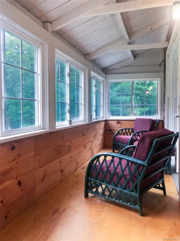 a bedroom with furniture and windows