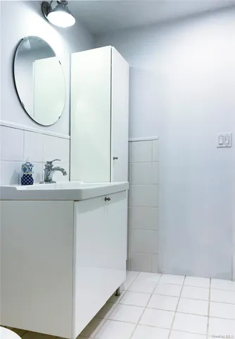 a bathroom with a sink and mirror