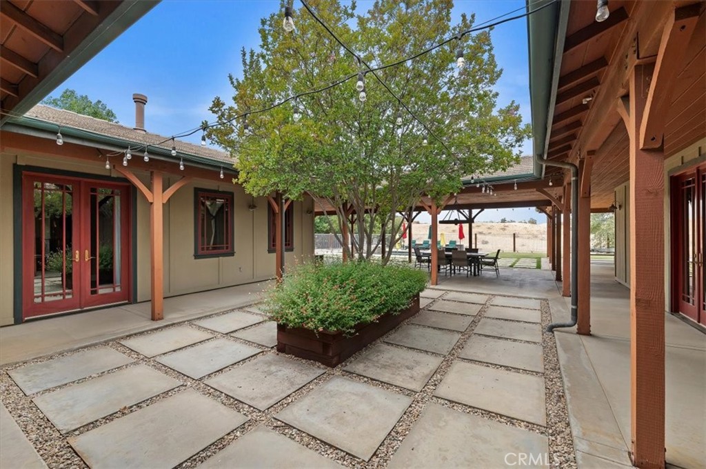 16420 Rocky Glen Road Perris, CA 92570 - Photo 51 of 74 a view of a porch with a bench