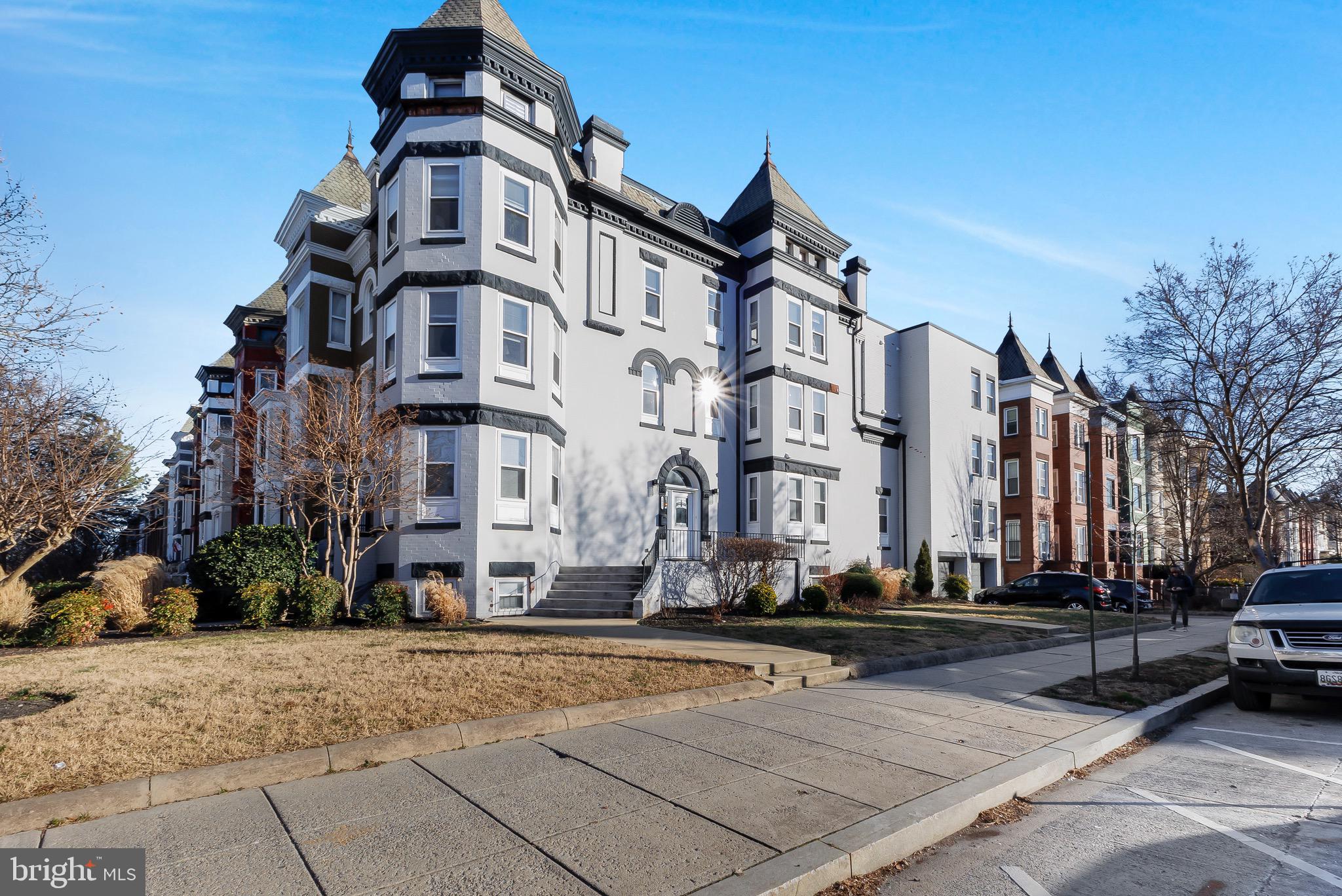 a front view of a building with street view