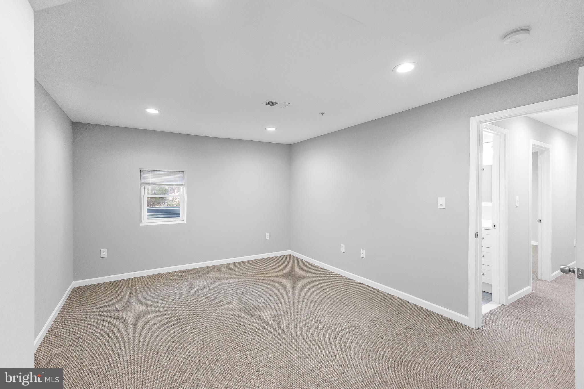 2917 13th Street Northwest Washington, DC 20009 - Photo 19 of 33 an empty room with a empty space and windows