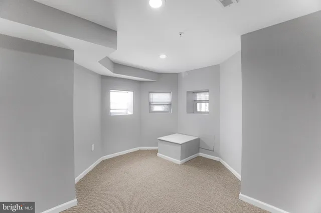 a bathroom with a sink toilet and mirror