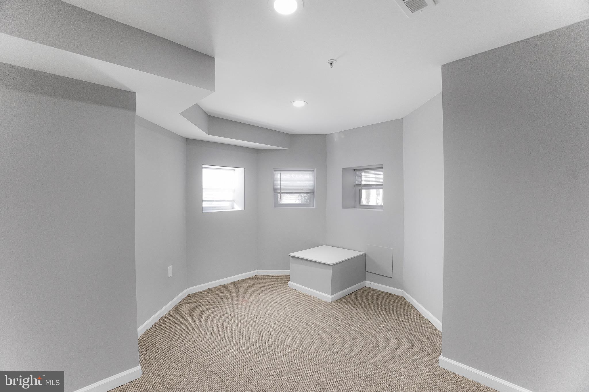 2917 13th Street Northwest Washington, DC 20009 - Photo 20 of 33 a view of a room with wooden floor and windows
