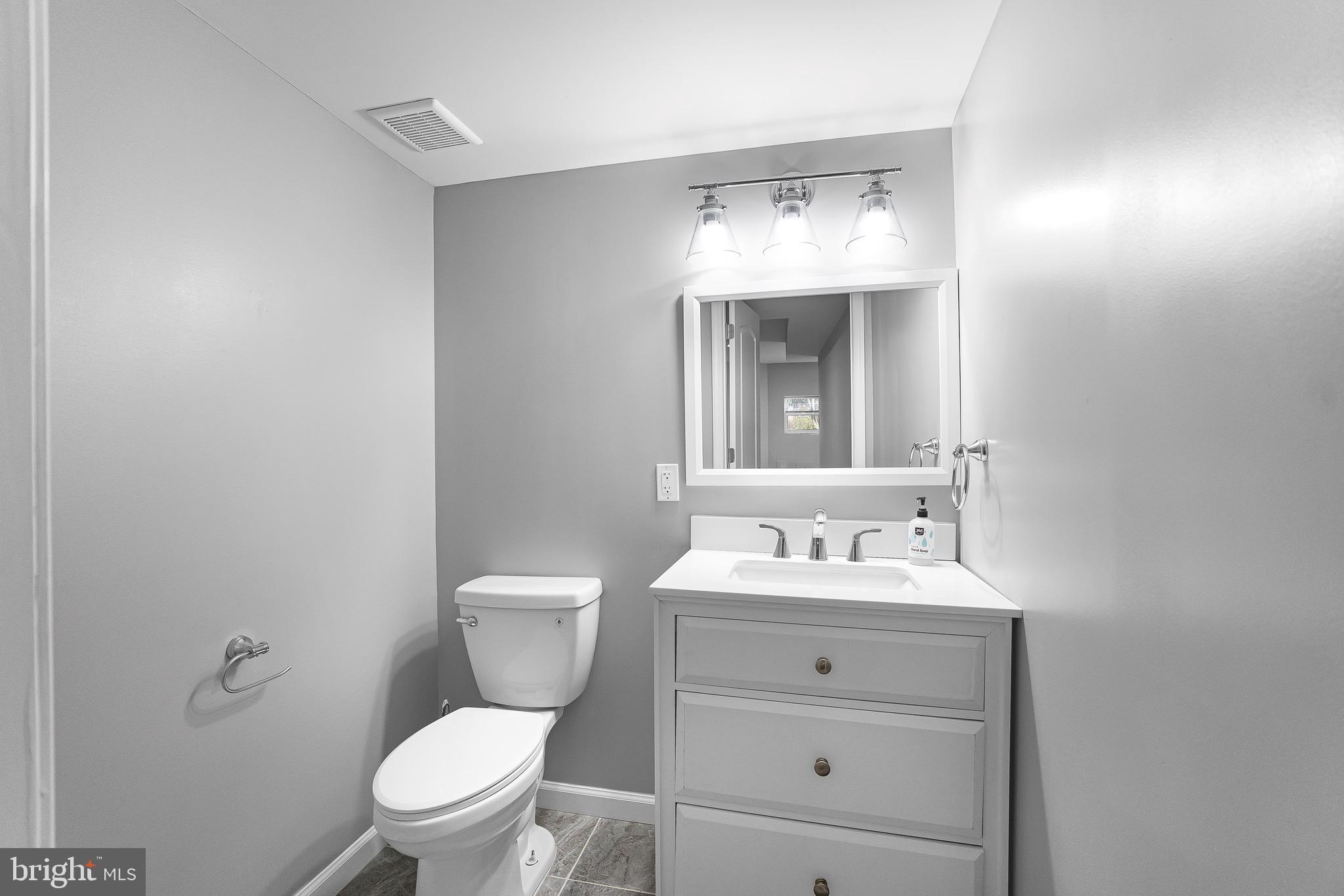 2917 13th Street Northwest Washington, DC 20009 - Photo 24 of 33 a bathroom with a sink toilet and mirror