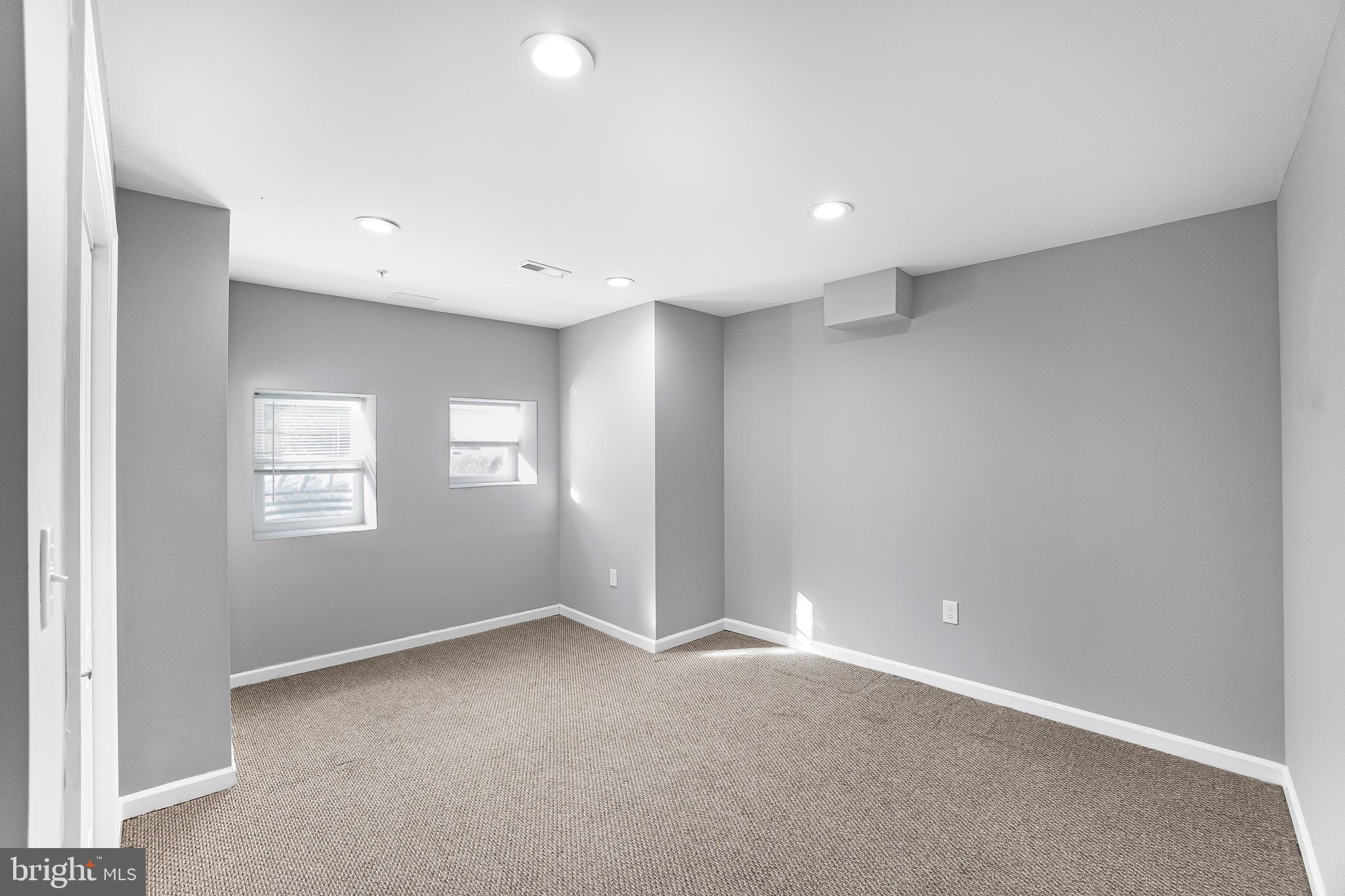 2917 13th Street Northwest Washington, DC 20009 - Photo 26 of 33 an empty room with a empty space and windows