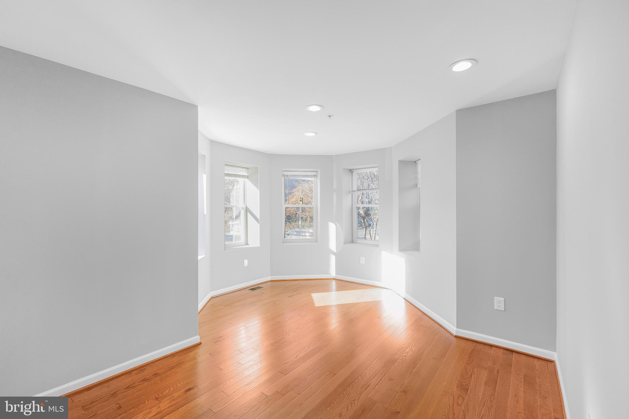 2917 13th Street Northwest Washington, DC 20009 - Photo 4 of 33 a view of an empty room with wooden floor