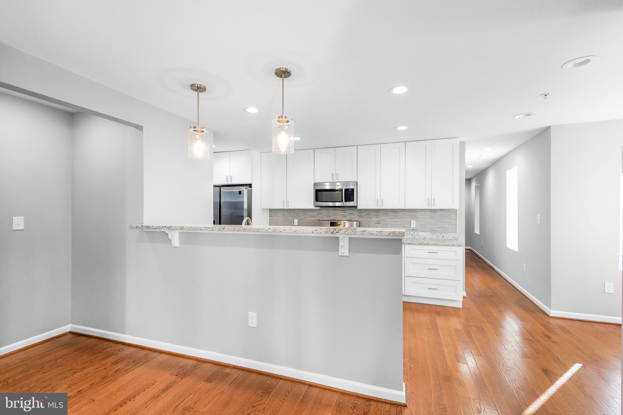 2917 13th Street Northwest Washington, DC 20009 - Photo 6 of 33 a view of kitchen with wooden floor